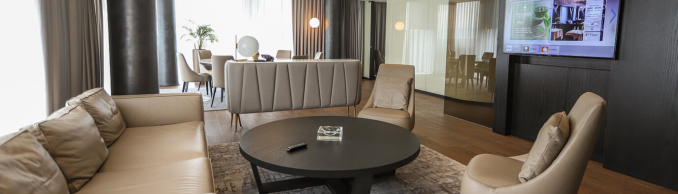 Elegant lounge area with leather sofas and armchairs at Maritim Hotel Plaza Tirana