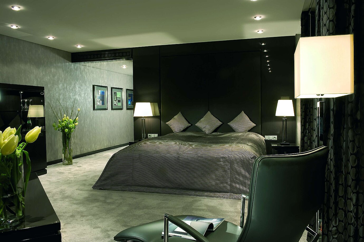 Bedroom of the Master Suite at Maritim Hotel Düsseldorf with a luxurious double bed, modern lighting, and elegant decor.