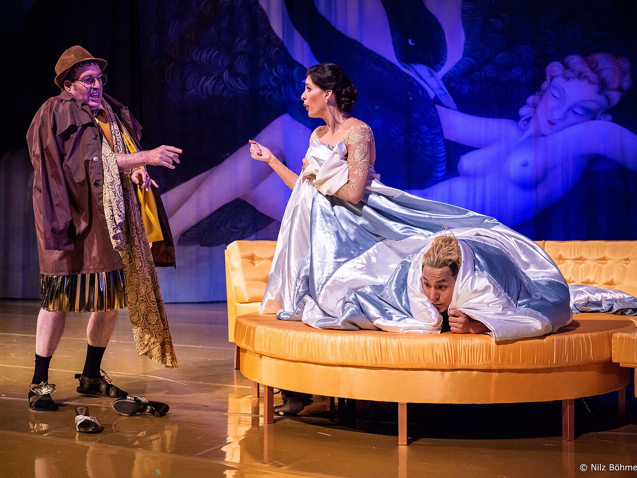 Theater Magdeburg Opera scene with performers in historical costumes on a theatre stage during a live performance