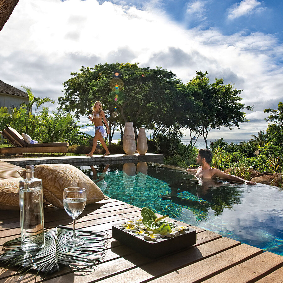 Private pool villa with infinity pool, sun deck and tropical garden with sea view
