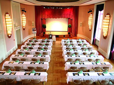 Historic lecture hall at Maritim Hotel Bad Wildungen with stage and daylight