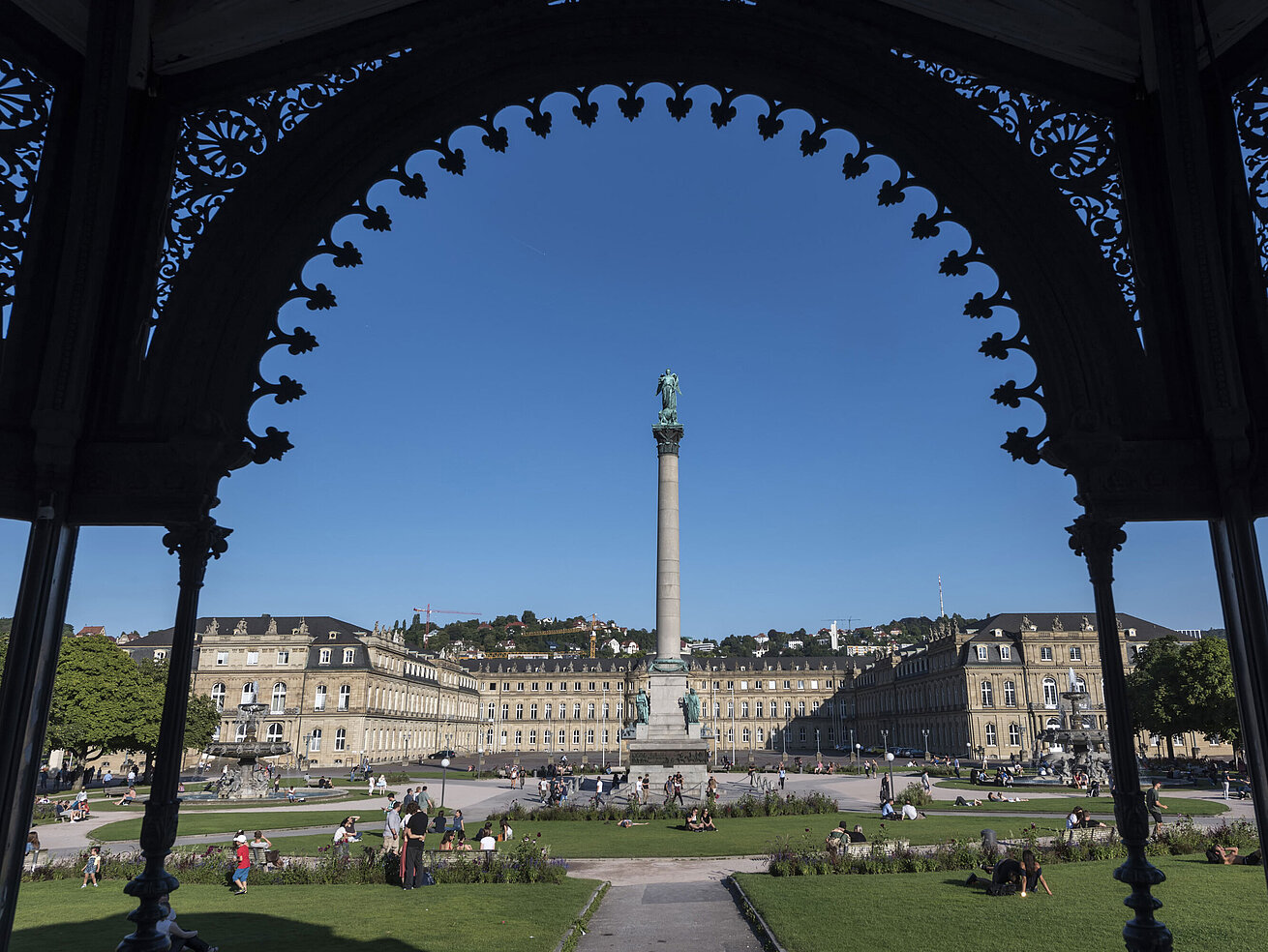 Neues Schloss Jubilee Column at Schlossplatz in Stuttgart, framed by the historic music pavilion