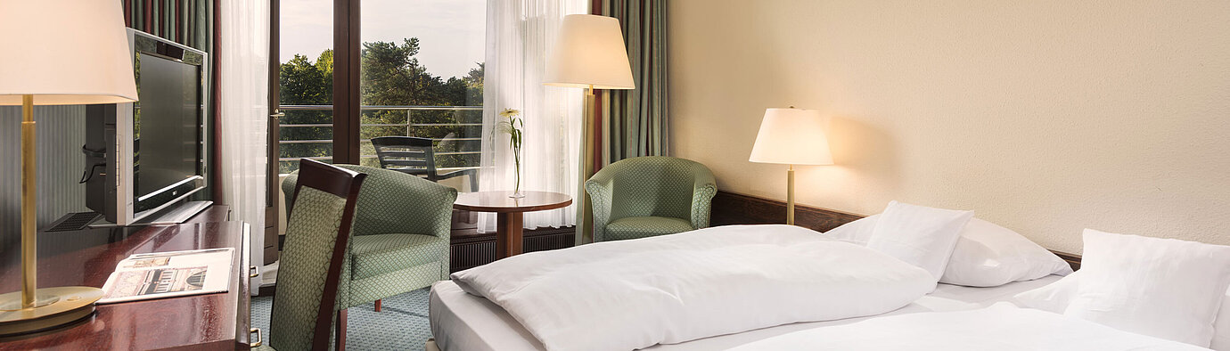 Comfort room Double room with balcony, armchairs and desk at Maritim Hotel Bad Salzuflen