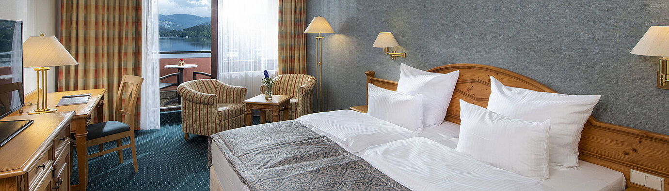 Superior room Spacious room at Maritim TitiseeHotel with seating area and view of Lake Titisee