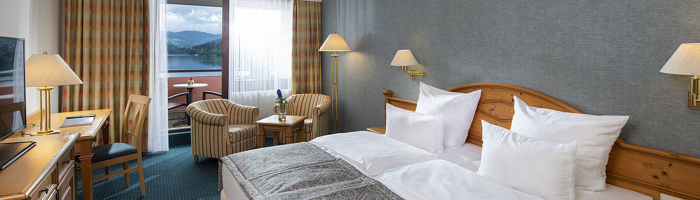 Superior room Spacious room at Maritim TitiseeHotel with seating area and view of Lake Titisee