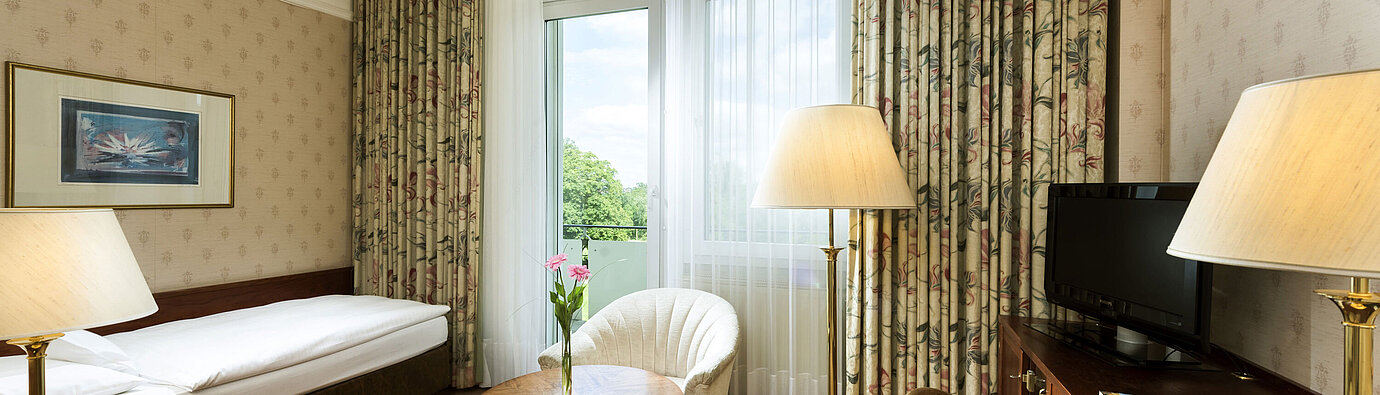 Single room with balcony and green view at Maritim Hotel Bad Wildungen