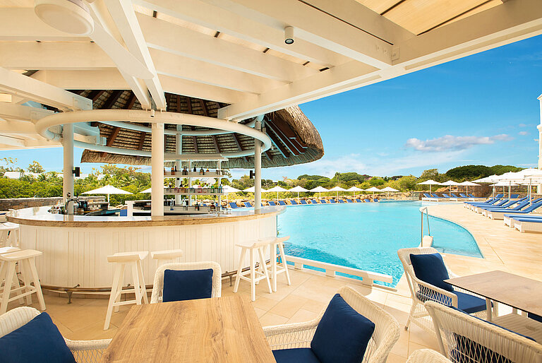 River Side Bar A stylish pool bar with modern furniture and a wonderful view of the beach and pool area