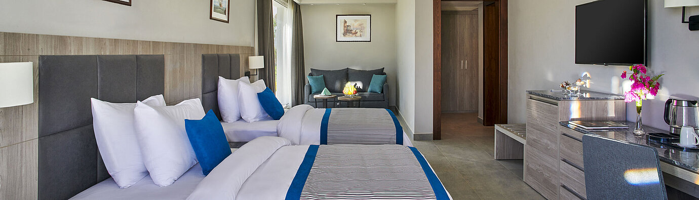 Sport Area Deluxe Room Modern family room at Maritim Jolie Ville Resort & Casino Sharm El Sheikh with two double beds