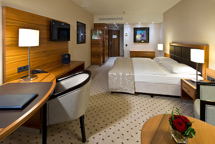 Comfortable Classic room at Maritim Hotel Bad Homburg with modern design and desk.